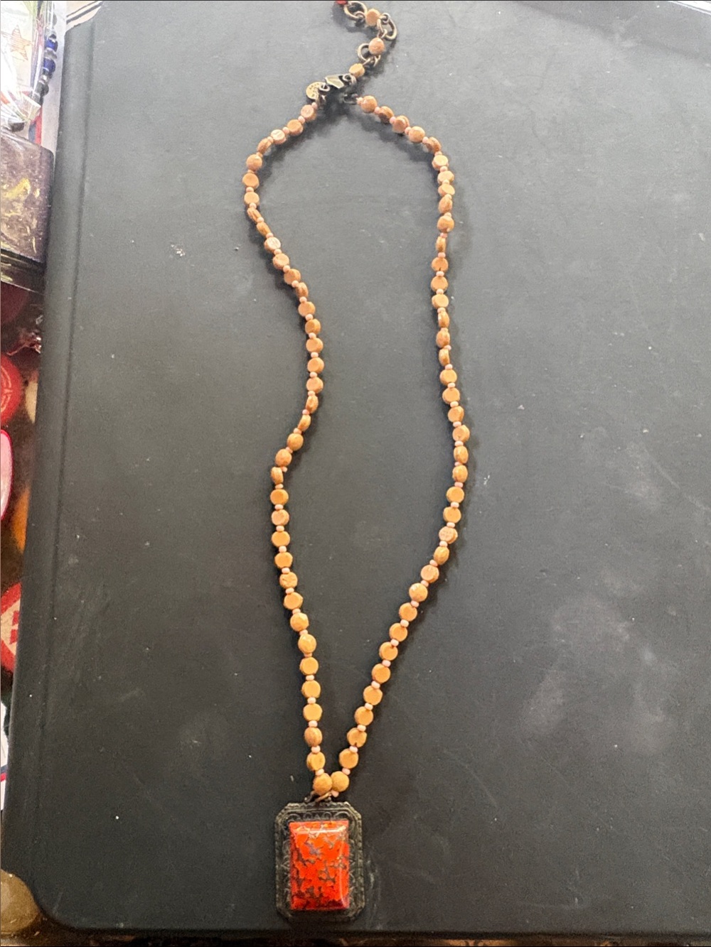 Natural Orange Stone w/metallic hue on designed metal Pendant taupe beads